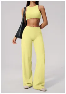 Detailed view of yellow high-waisted wide-leg sports yoga pants for active women
