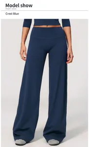 Detail of premium high-waisted wide-leg yoga pants for women in navy blue color