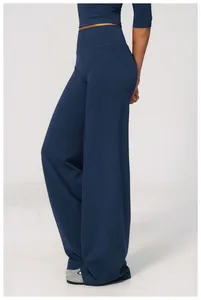Close-up of women's high-waisted navy wide-leg yoga pants in soft brushed fabric