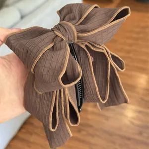 Elegant large brown bow hair clip with unique textured grid fabric for women accessories