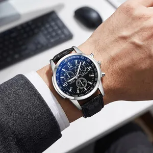 Close-up of men's quartz watch with blue dial and black leather strap
