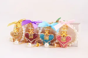 Detailed view of colorful rhinestone perfume bottle charms with satin bows and pearl chains