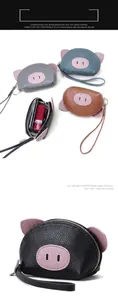 Detailed view of cute pig-shaped genuine leather coin purse with zipper and strap