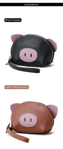 Detailed view of cute pig-shaped leather coin purses in black and tan brown colors