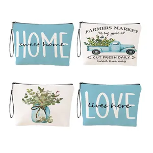 Quatre trousses de maquillage en toile avec motifs sweet home et love et dragonnes.