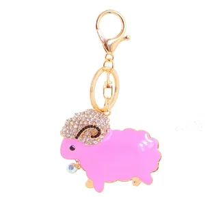 Detail view of pink rhinestone sheep keychain with sparkling gems and gold clasp