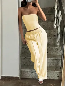 Casual summer yellow two-piece set featuring a strapless tube top and matching wide-leg pants.