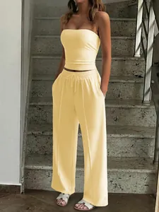 Elegant yellow two-piece set featuring a strapless tube top and matching wide-leg pants