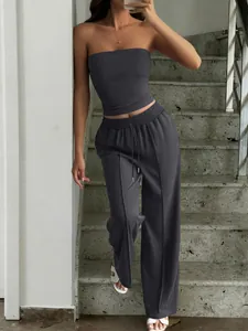 Casual summer two-piece set featuring charcoal grey tube top and high waist wide-leg trousers