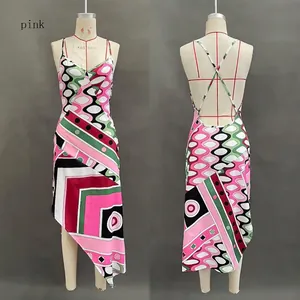 Detailed view of pink geometric print backless sleeveless dress with irregular hemline