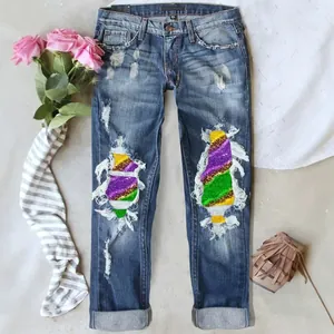 Distressed mid-rise straight jeans with colorful sequins patches and ripped details