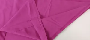 High-quality stitching and durable hem detail on elegant magenta wide-leg jumpsuit