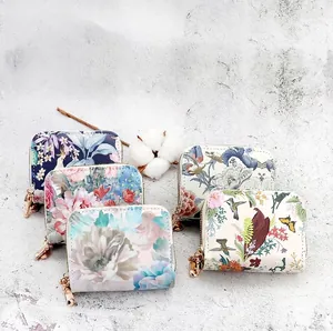 Collection of Chinese style floral accordion card bags with elegant double gold zippers