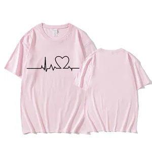 Close-up view of the minimalist pink heart line print on a casual round neck t-shirt
