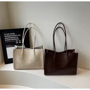 Large capacity textured tote bags in beige and brown for women's daily commute.