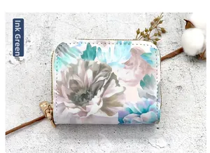 Detail of floral double-zipper card holder in ink green finish