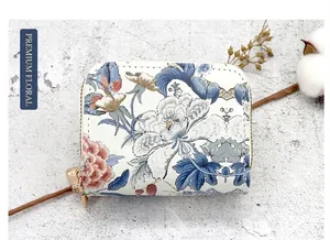 Detailed view of women's vintage floral double zipper card holder and coin purse