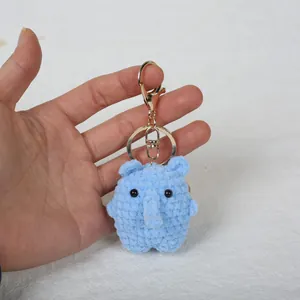 Handmade crochet light blue elephant keychain accessory with golden metal clasp charm
