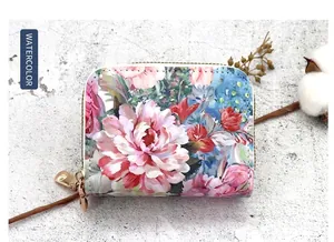 Detailed view of elegant floral print double zipper coin purse with vibrant ink red flowers