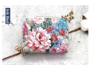 Detailed view of elegant floral print double zipper coin purse with vibrant ink red flowers