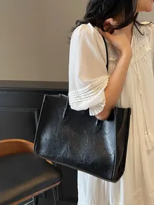 Premium black faux leather tote bag with large capacity for stylish office commuting