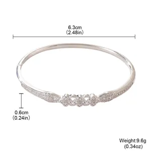 Detail view of a petal zircon bangle showing 6.3cm diameter and 0.6cm width.