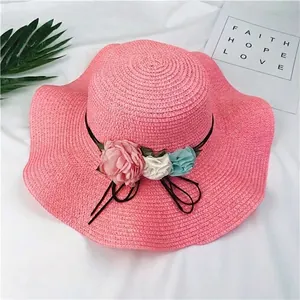 Stylish women's foldable pink straw sun hat with elegant multi-color flower decor