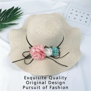 Elegant wide brim foldable straw sun hat with decorative fabric flowers for women