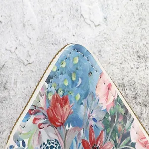Close-up detail of precision stitching on a vintage floral pattern card holder wallet