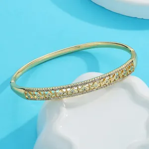 Exquisite detail of a gold-plated petal zircon bracelet with intricate hollow engravings