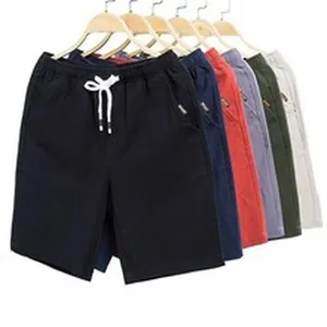 Collection of breathable men's cotton linen casual shorts in various colors hanging