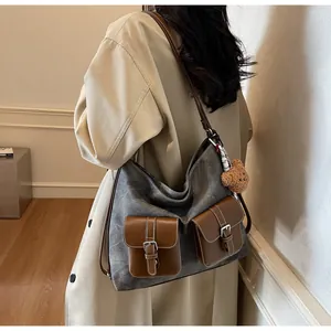 Stylish large denim texture canvas shoulder bag with brown leather buckle pockets and bear