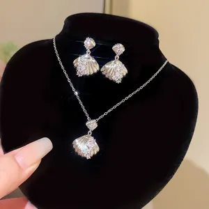 Elegant silver-tone shell pendant necklace and matching crystal earrings jewelry set