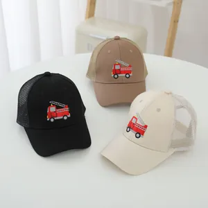 Detail view of children's mesh baseball caps with cute fire truck embroidery in three colors