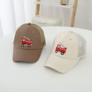 Detailed view of kids summer mesh baseball caps with red fire truck embroidery design