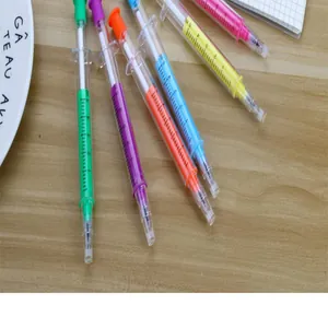 Creative colorful syringe-shaped gel pens for student stationery on a wooden desk
