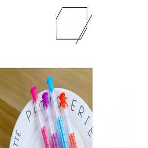 Dettaglio ravvicinato di penne gel a forma di siringa in vari colori su un piatto