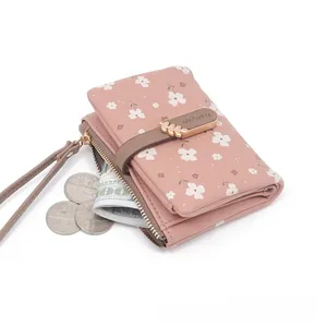 Stylish pink floral short wallet for women with secure buckle and zipper closure