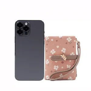 Floral print women's short wallet with wristlet and metal leaf clasp for size comparison