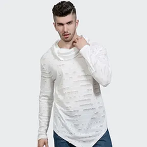Close-up detail of a white long-sleeve shirt with cowl neck and ripped textured fabric.