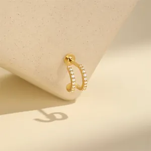 Detail view of gold-plated s925 silver double-layered C-shaped CZ paved cartilage stud