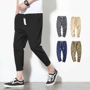 Detail view of breathable men's linen cropped pants showing black fit and color variants