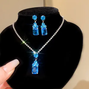 Close-up of luxurious blue crystal necklace and earrings jewelry set with sparkles