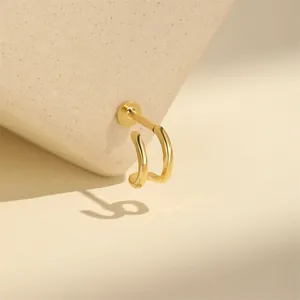 Close-up of golden s925 silver double-layer C-shape cartilage earring with flat back