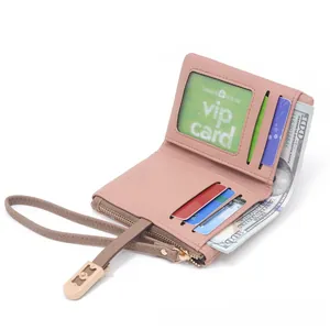 Detail of the internal compartments in a pink women's bifold wallet with card slots