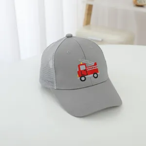 Detailed view of gray kids mesh baseball cap with red fire truck embroidery.