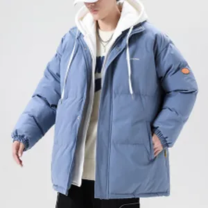 Men's oversized light blue puffer jacket with white hood and streetwear style details.