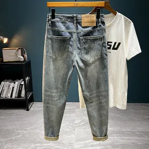 Men's Vintage Washed Slim Fit Cropped Jeans Cotton Blend Elastic Light Blue Denim Pants With Back Pocket Letter Print