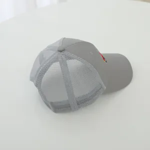 Detail of grey children's mesh baseball cap with cute cartoon fire truck embroidery