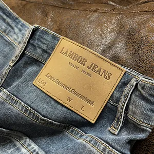 Vintage blue washed slim fit stretch denim jeans featuring classic leather back patch